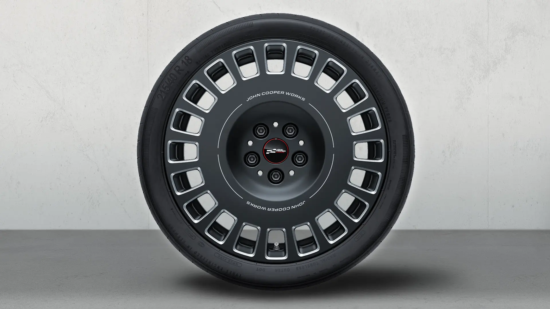 18 inch MINI JCW Rallye Spoke 964 wiel uitgevoerd in Frozen Midnight Grey, diamond-milled.