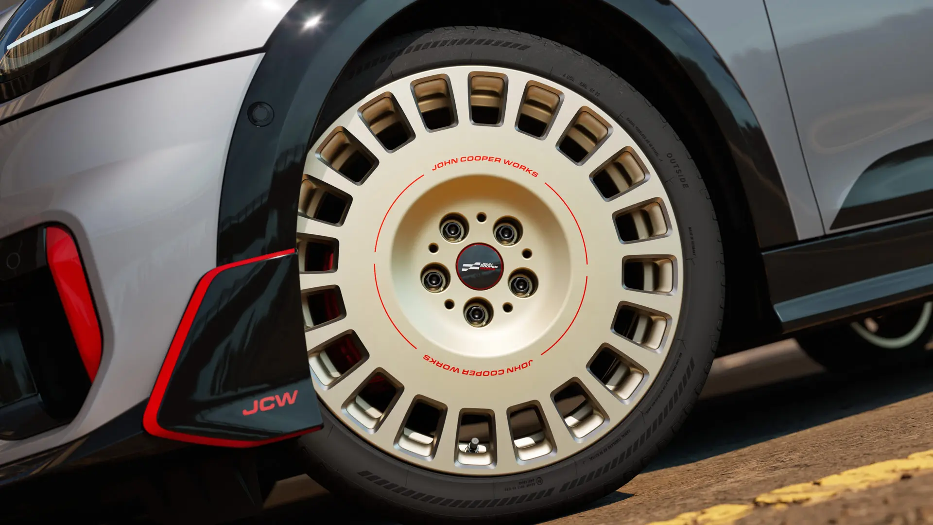 Close-up van een 18 inch JCW Rallye Spoke 964 wiel in Bicolour Vibrant Silver en diamantgefreesd met winglet voor.