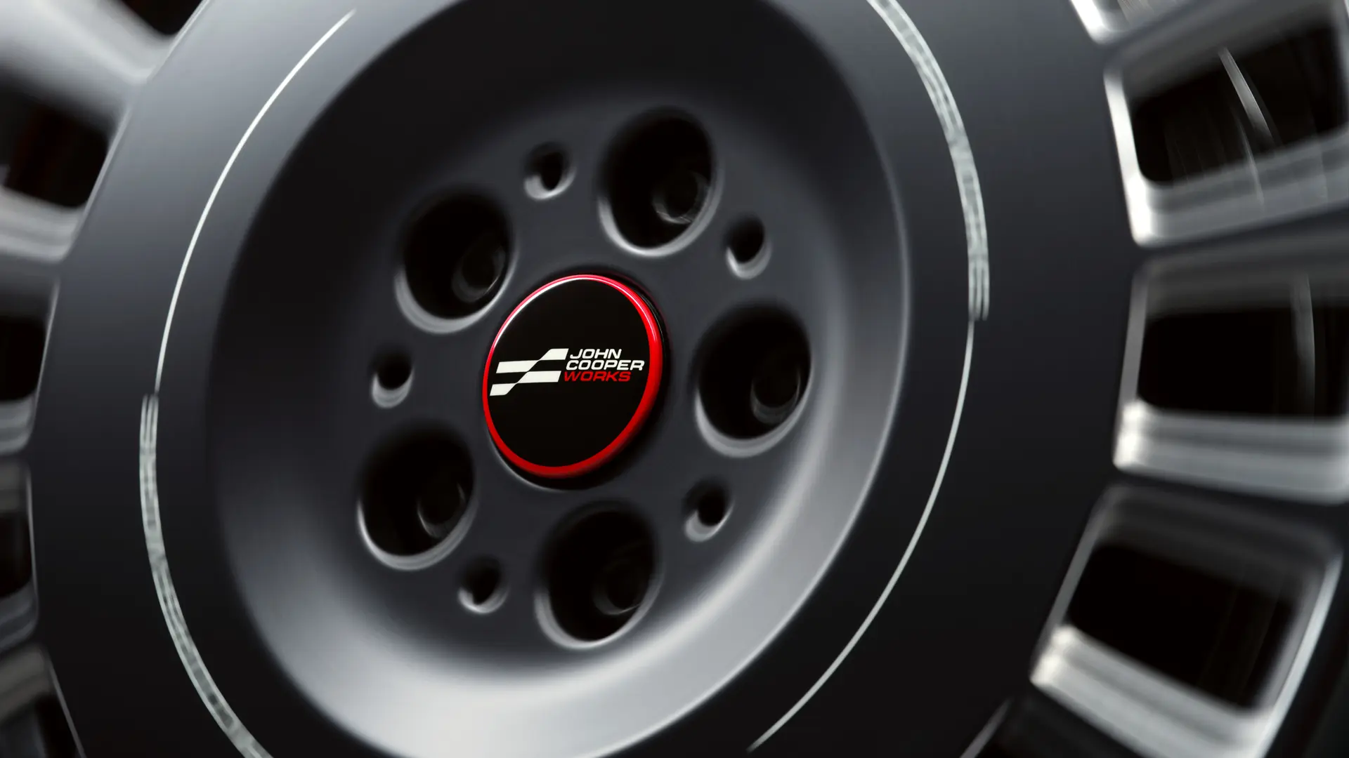 Cache-moyeu flottant John Cooper Works qui reste horizontal en roulant, sans tourner avec la roue. 