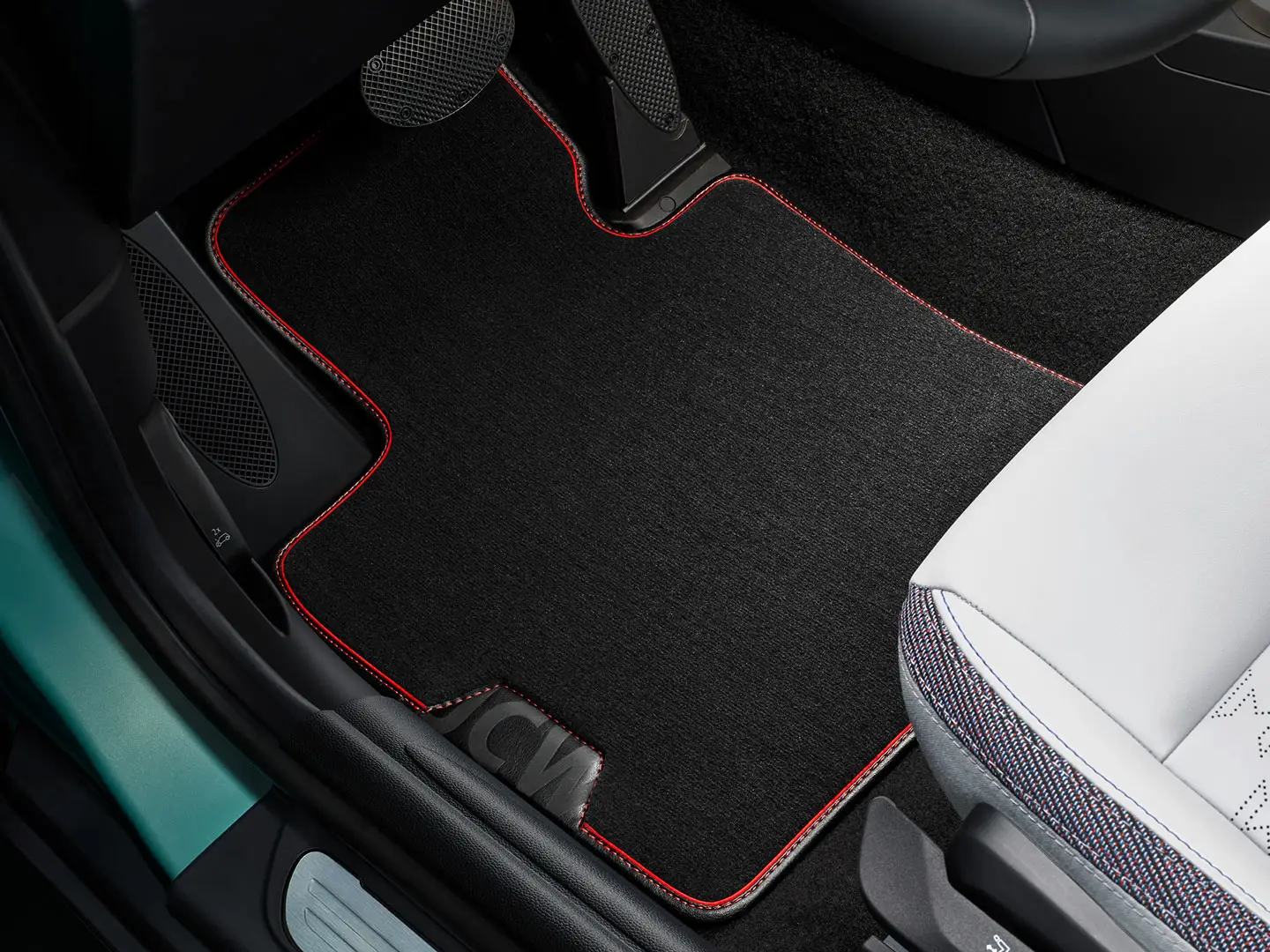 Tapis de sol textile MINI John Cooper Works dans l’espace aux pieds.